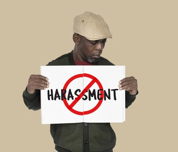 Adult African man holding placard — Stock Photo, Image