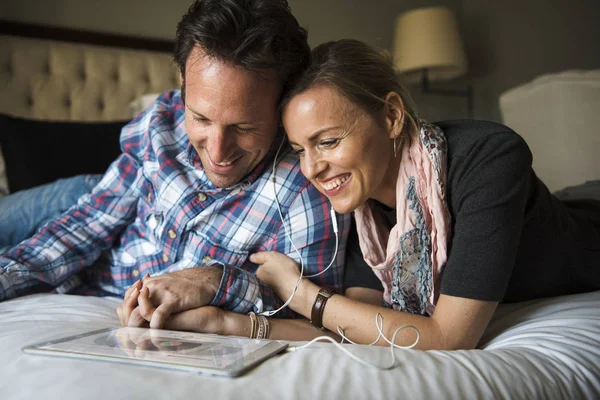 couple using digital tablet