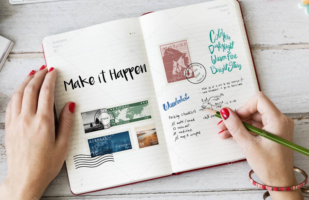 Woman's hands writing in notebook 