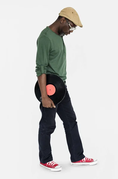 Людина тримає вініловий диск — стокове фото