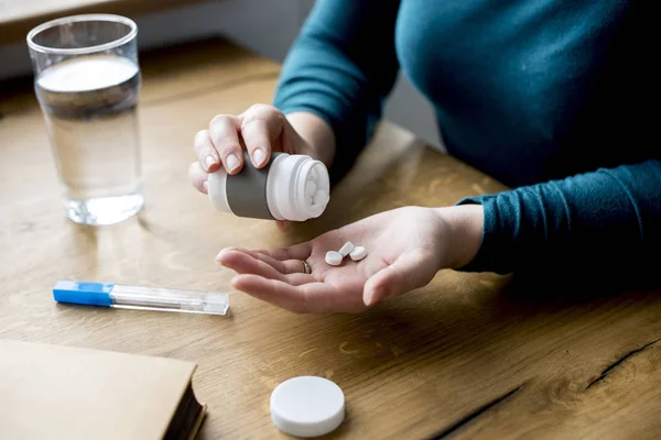 woman Taking Medicine Pills