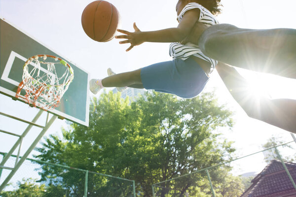 family playing basketball