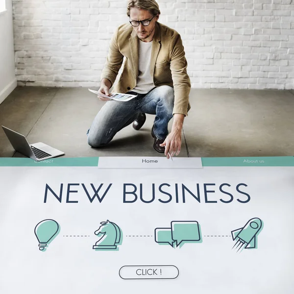 Businessman working near poster — Stock Photo, Image