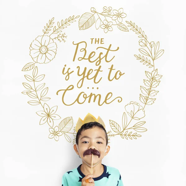 Boy holding paper mustache — Stock Photo, Image