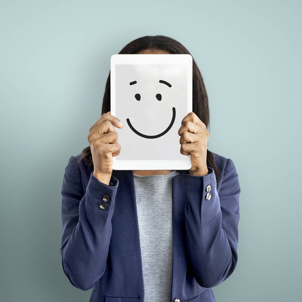 Businesswoman Covering Face with Digital Tablet
