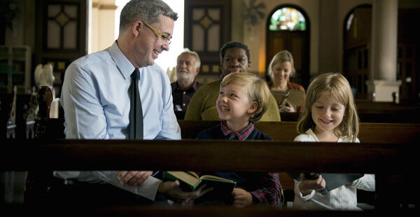 Family praying in the Church