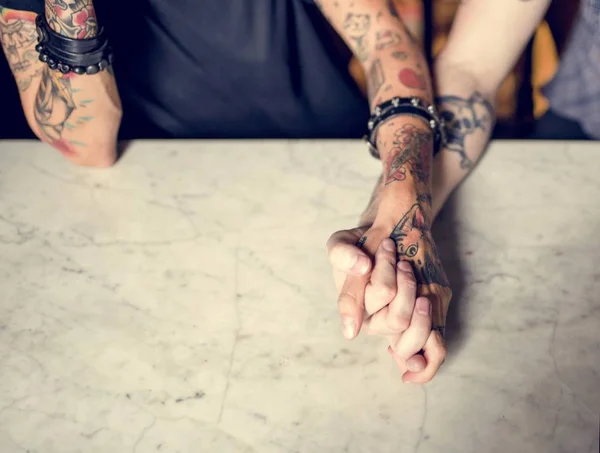 Tattooed Hands Holding Together — Stock Photo, Image