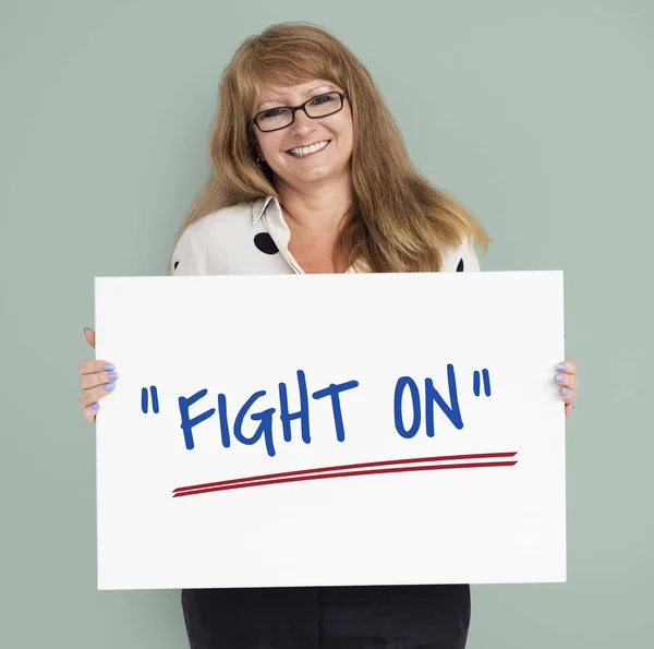 Woman holding placard — Stock Photo, Image