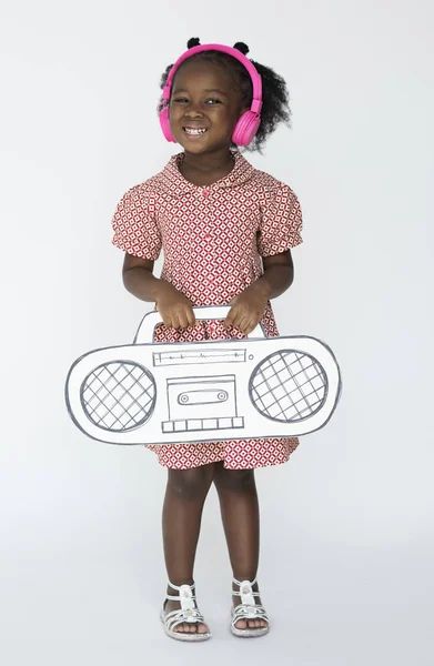 Adorable niña en auriculares —  Fotos de Stock