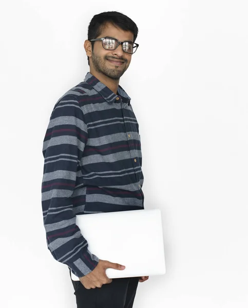 Indian man with laptop in studio — Stock Photo, Image