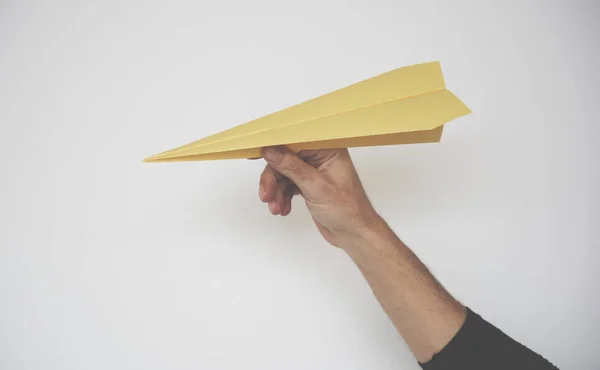 Origami carta aereo in mano — Foto Stock