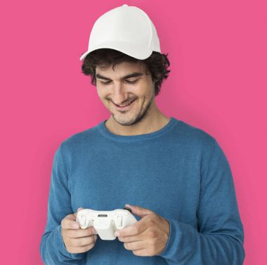 Man in cap playing with game controller clipart