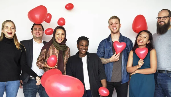 happy people with heart balloons