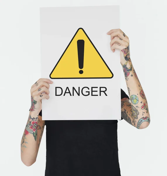 Woman with tattoos holding placard — Stock Photo, Image