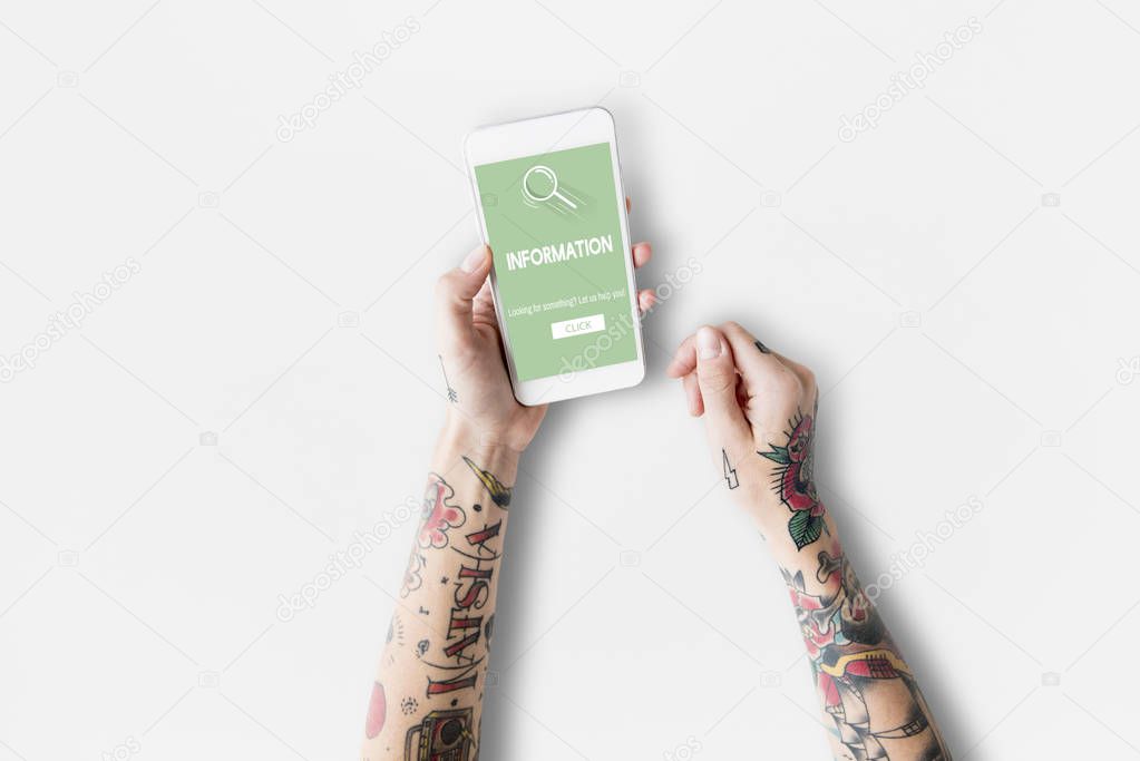 Tattooed woman hands with smartphone