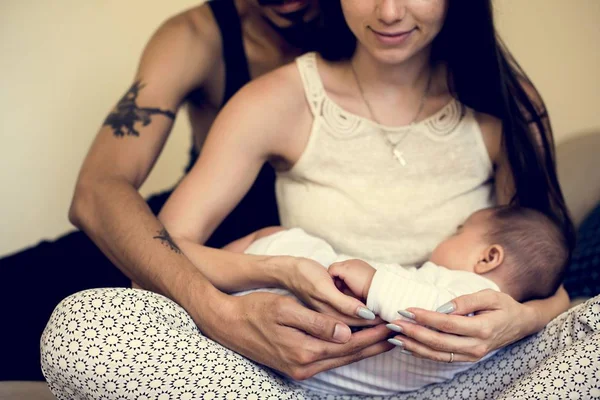 Parents holding sleeping baby — Stock Photo, Image