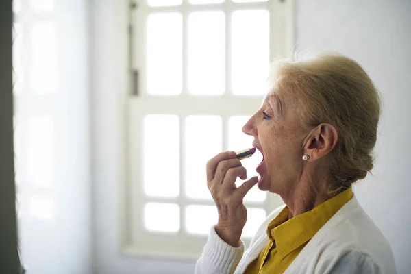 Senior Woman with lipstick — Stock Photo, Image