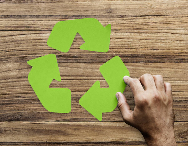 human hand and green arrow