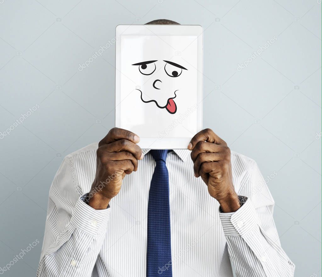african Businessman Covering Face with Tablet