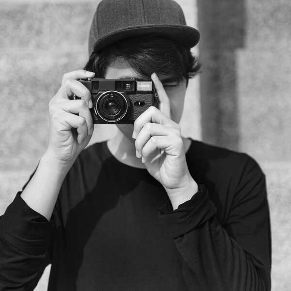 asian boy taking photo