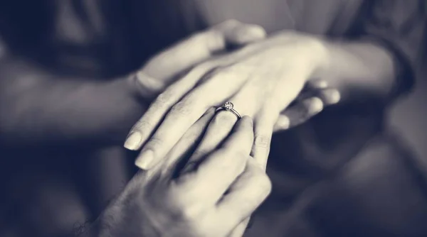 Man putting ring on finger — Stock Photo, Image