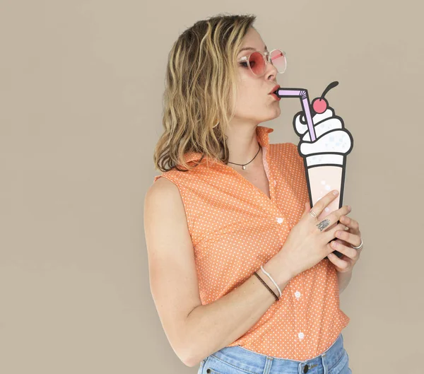 Woman eating paper ice cream — Stock Photo, Image