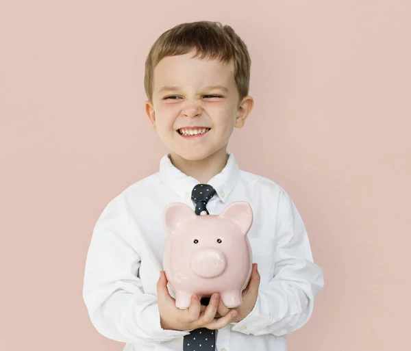 Rapaz segurando piggybank — Fotografia de Stock