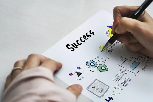 Person holding pen and writing — Stock Photo, Image