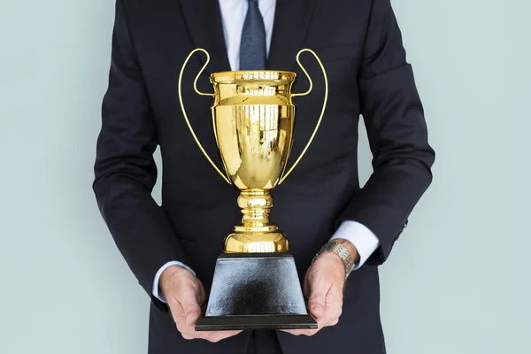 Businessman Holding golden Trophy — Stock Photo, Image