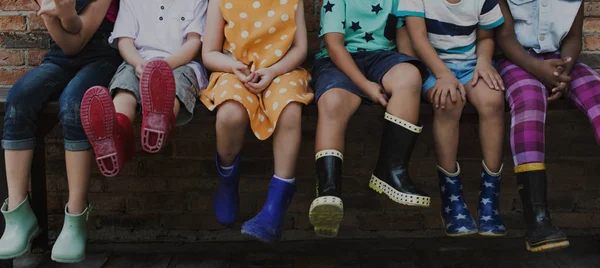 Group of kindergarten kids siting outdoors — Stock Photo, Image