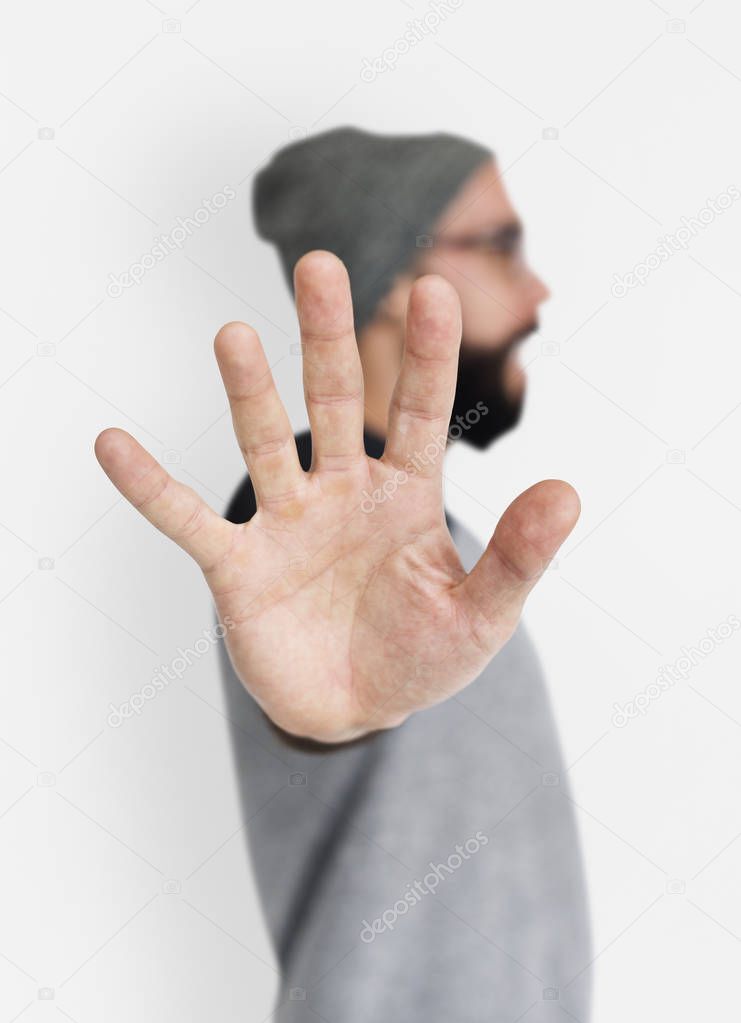  man showing stop symbol with hand