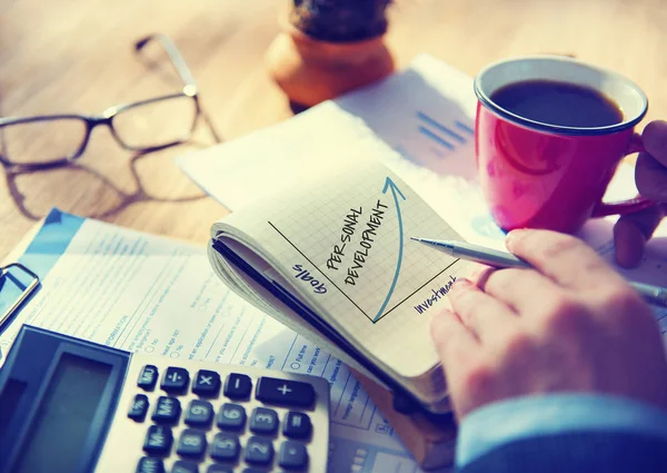 Businessman writing in notebook — Stock Photo, Image