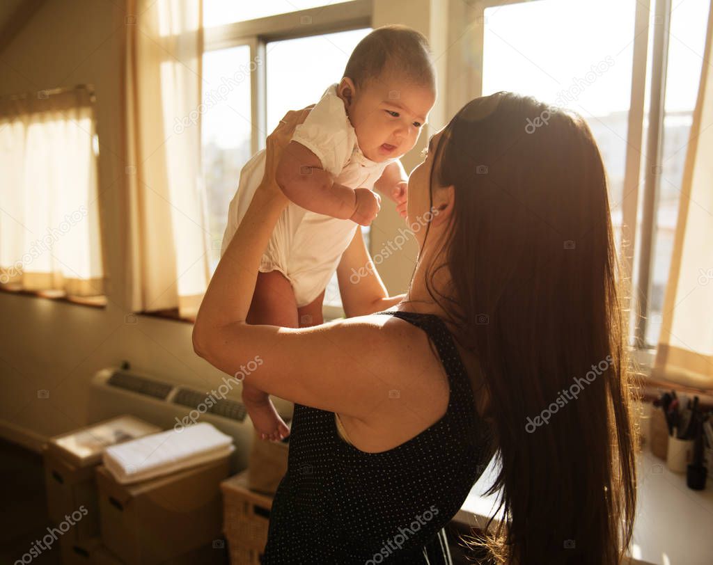 mother holding newborn baby