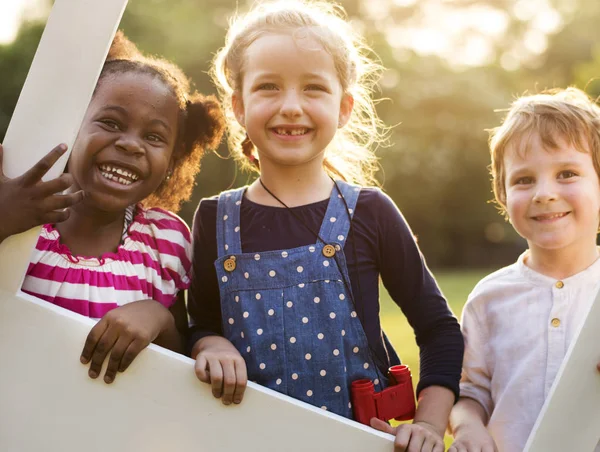 Kindergarten kids playing on playground — Stock Photo, Image