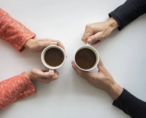 Human hands holding coffee cups — Stock Photo, Image