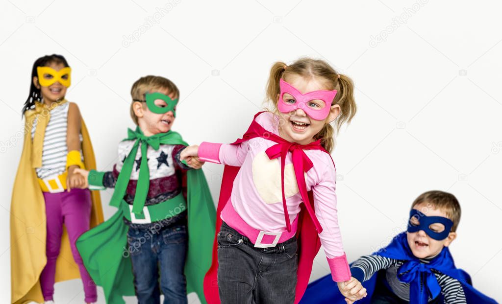 happy children in Superhero costumes