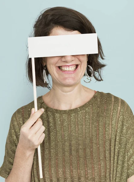 Mujer cubriendo los ojos con banner —  Fotos de Stock