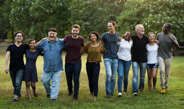 people huddle and smiling together