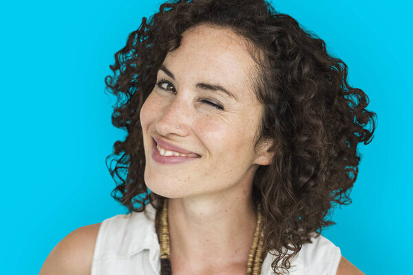 curly hair woman in studio smiling