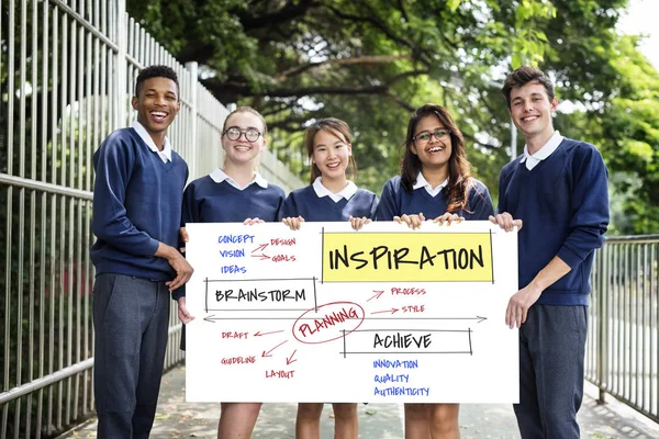 Students holding placard — Stock Photo, Image