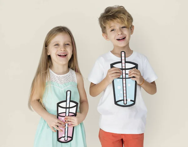 KIds Holding Paper Drinks Stock Picture