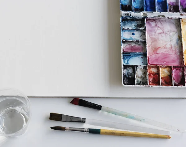 Watercolor paint and sketch pad — Stock Photo, Image