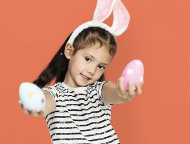 cute little girl with easter eggs