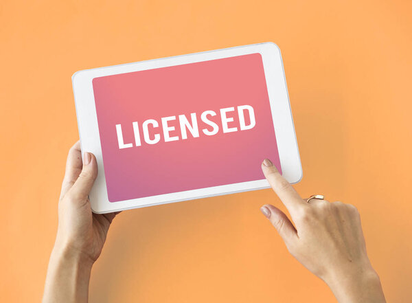 person holding digital tablet