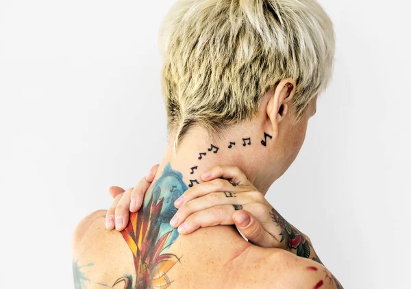 Studio shoot of tattooed woman — Stock Photo, Image