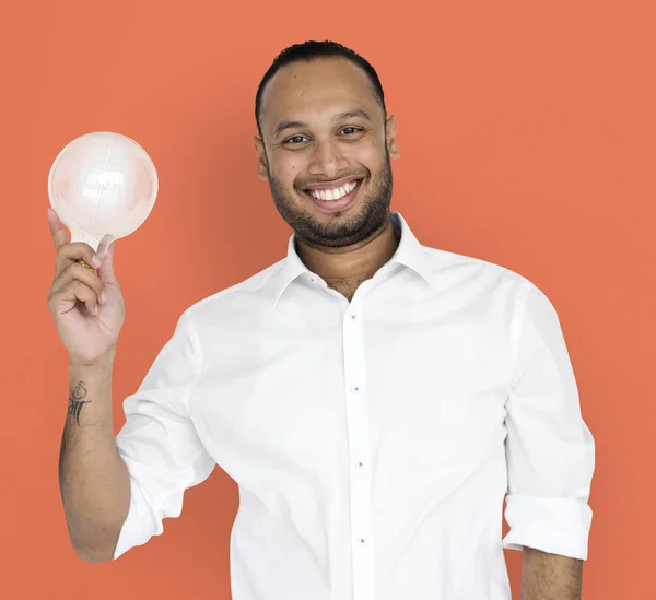 Empresário segurando lâmpada — Fotografia de Stock