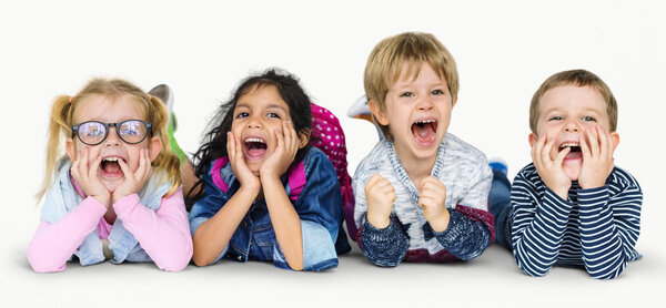 multi ethnic children laying on floor