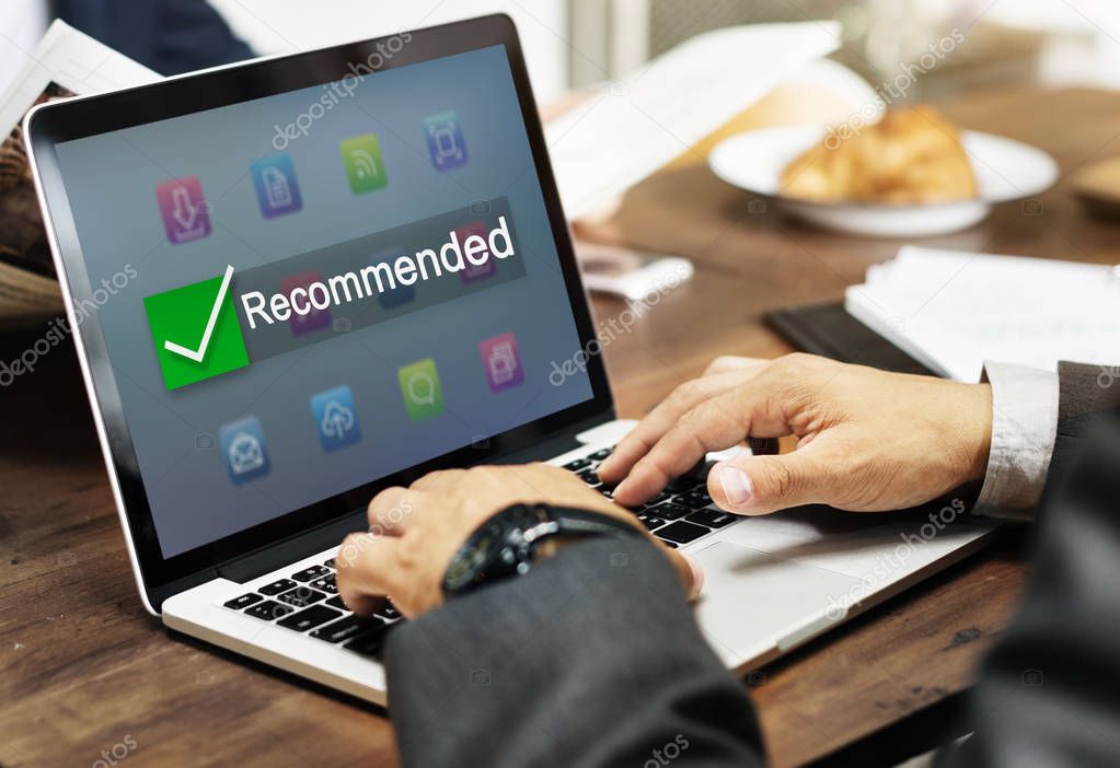 Businessman typing on laptop keyboard