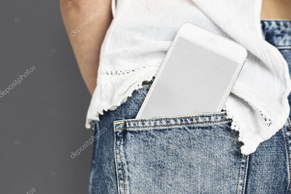 digital smartphone in jeans pocket
