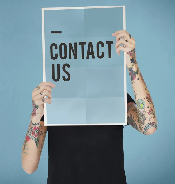 Tattooed person holding banner. — Stock Photo, Image